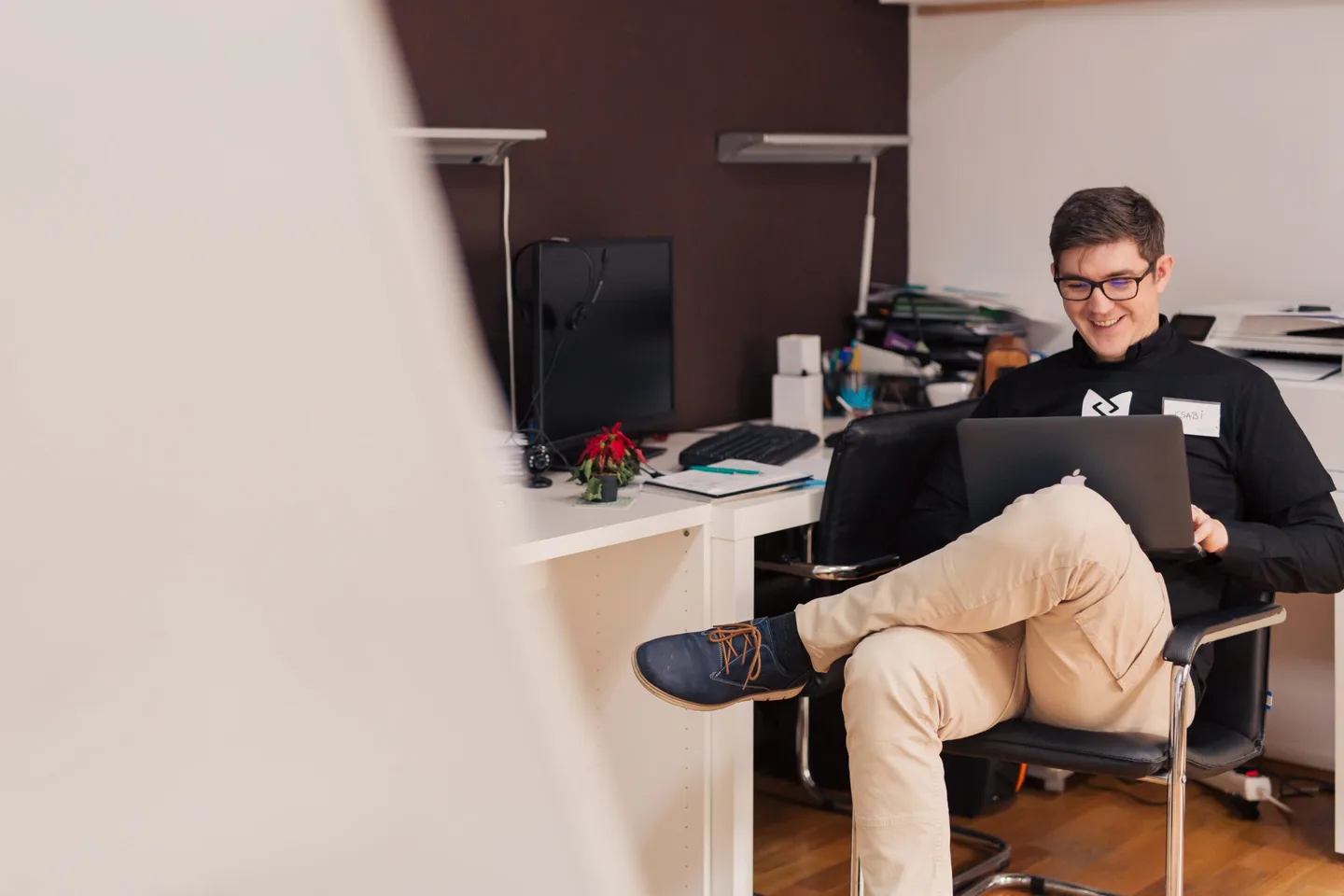 A person working on a laptop.